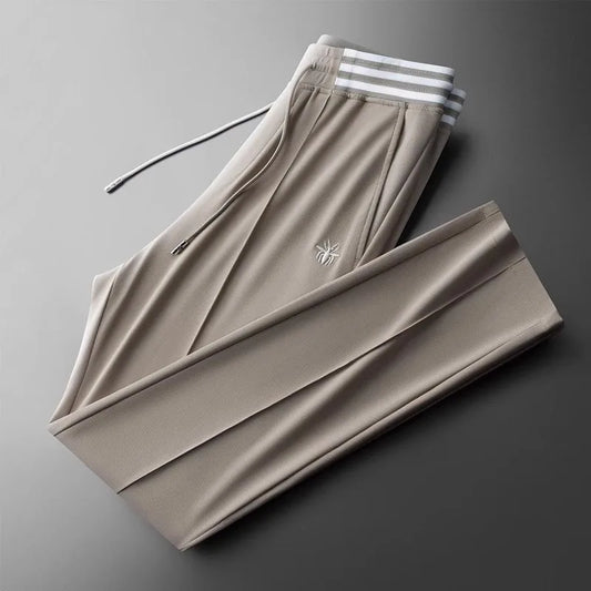 High end fashionable embroidered striped casual men's pants for the summer of 2024 new waffle ice silk comfortable sports pants